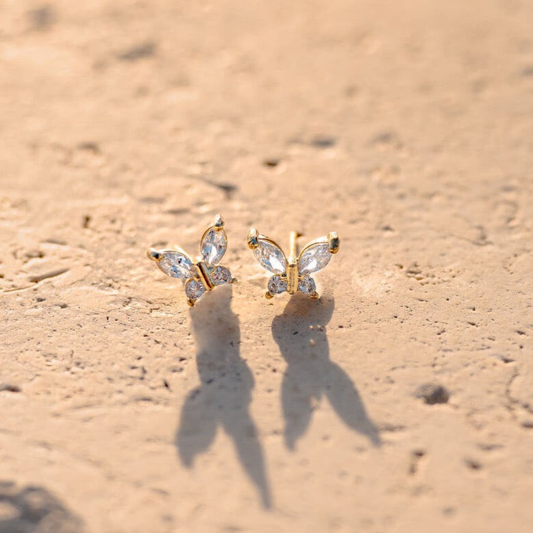 Sparkly butterfly shaped earrings, crafted with a 14K gold filled finish.