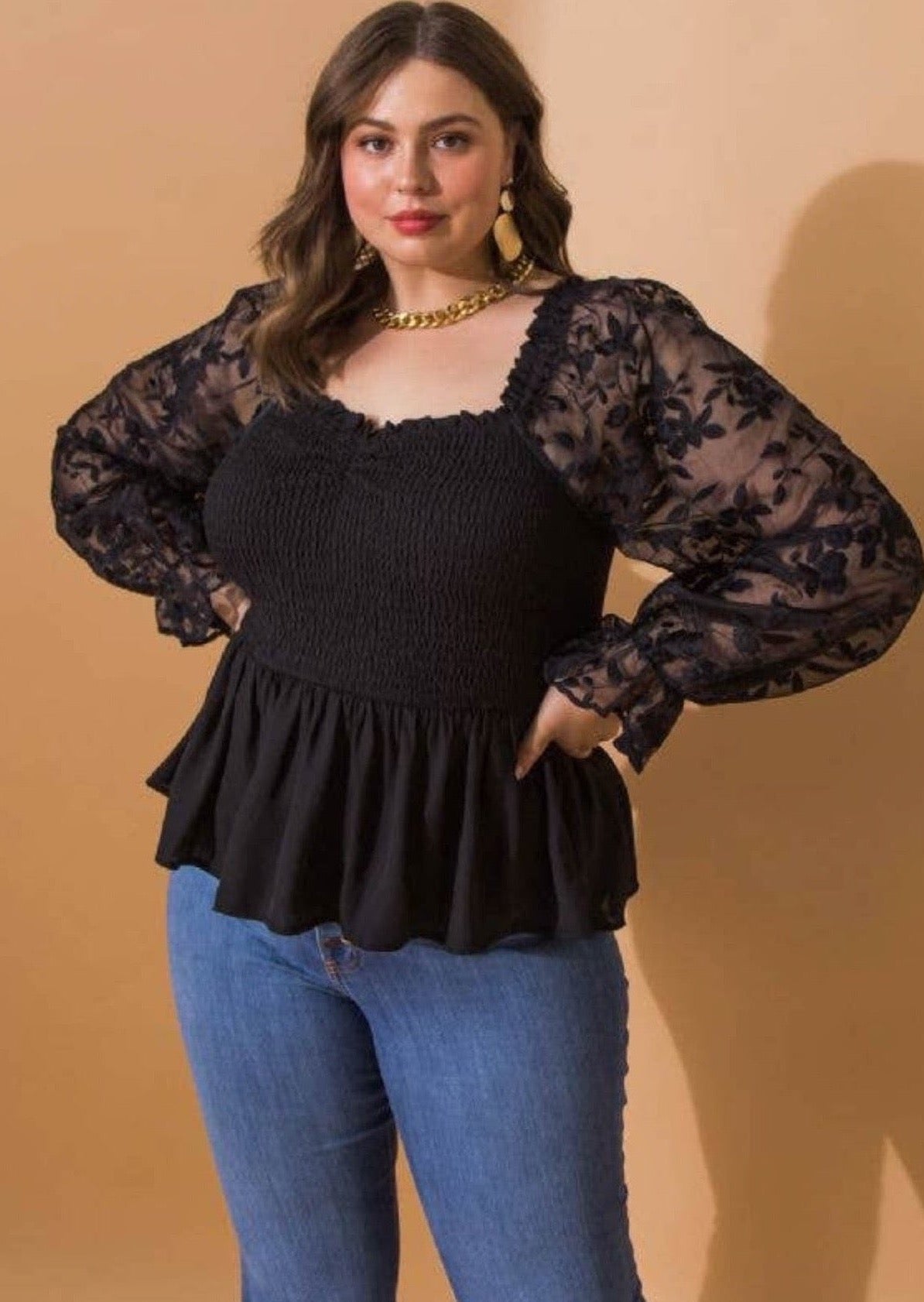 This top features a smocked bodice and square neckline, giving you a flattering fit that's bound to make you the center of attention, with contrasting sleeve with a ruffled cuff and peplum design.